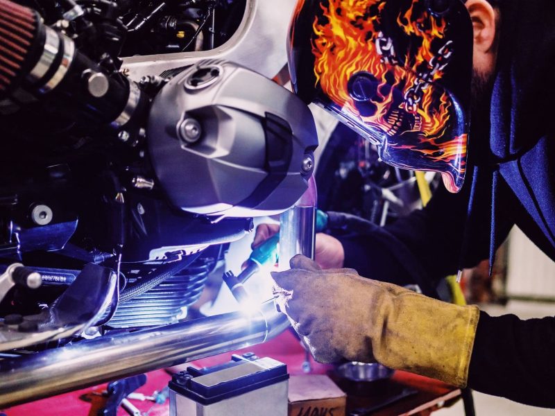 man-working-on-a-custom-motorcycle-unique-professions-concept-1-1.jpg